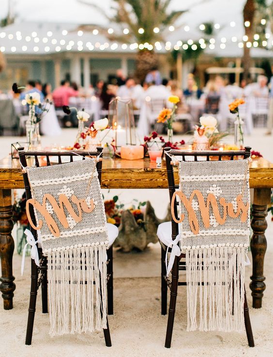 macrame hangings with super long fringe and calligraphy plaques are great for styling a boho wedding