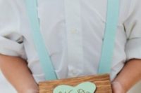 mint blue suspenders and a bow for styling a ring bearer