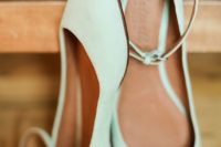 mint green flats with ankle straps are a subtle touch of color and a cool pastel look to the bridal outfit