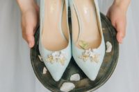 mint wedding shoes with gold and white flower detailing look whimsy and cool