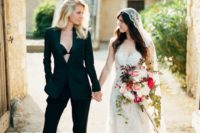 one bride rocking all black and the second bride wearing all ivory is a gorgeous idea