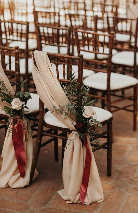 pair up neutral fabric and burgundy ribbons, neutral and burgundy blooms and greenery for a lovely look at a fall wedding