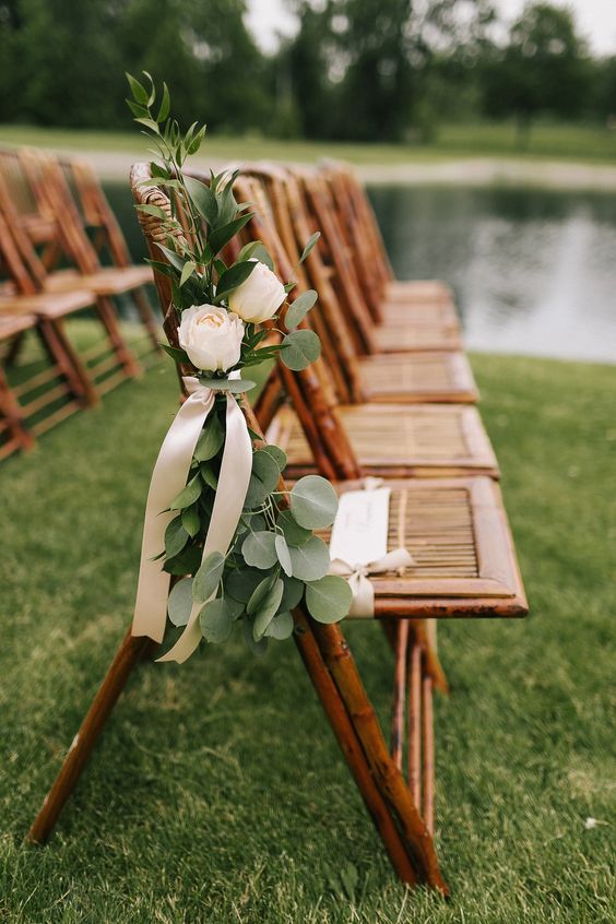 stained chairs with blush blooms, greenery and blush ribbon are amazing for a wedding, they will make your space look tender