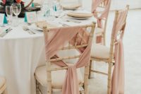 stylish chair decor with pink fabric will give the chairs an elegant and chic feel, and your wedding reception space will look more formal