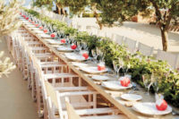the cream-colored tables and chairs at this reception offered a clean backdrop for length-wise greenery