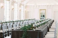 this black tie wedding pulled off banquet seating with elegant tablecloths and eucalyptus runners