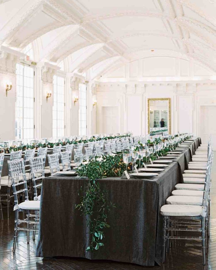 this black tie wedding pulled off banquet seating with elegant tablecloths and eucalyptus runners