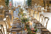 this rustic farm table seated the wedding party, and featured pink and peach flowers