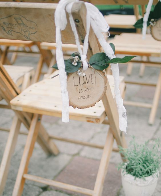 white ribbons, greenery, a wood slice are great for a woodland wedding, a backyard or just nature-inspired one