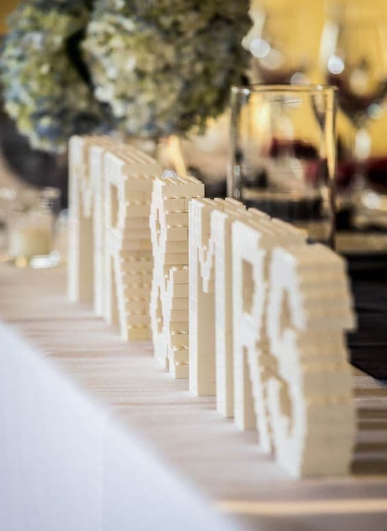 Mr and Mrs monograms made of white Legos look elegant and chic and can be used for any wedding style