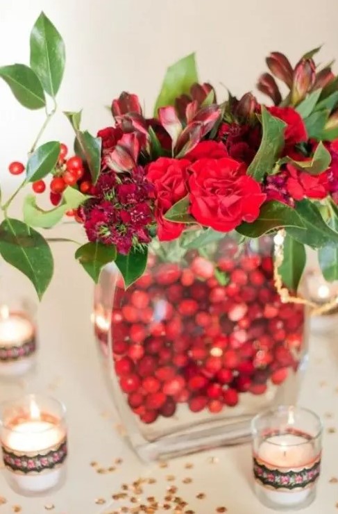 a stylish red winter wedding centerpiece