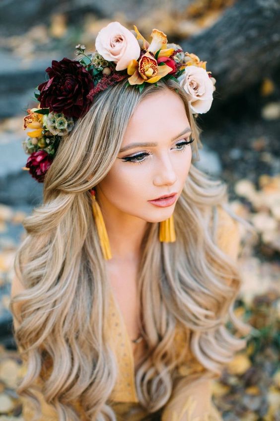 a bright flower crown for a boho fall wedding, with deep purple, yellow and blush blooms is a fantastic and contrasting solution