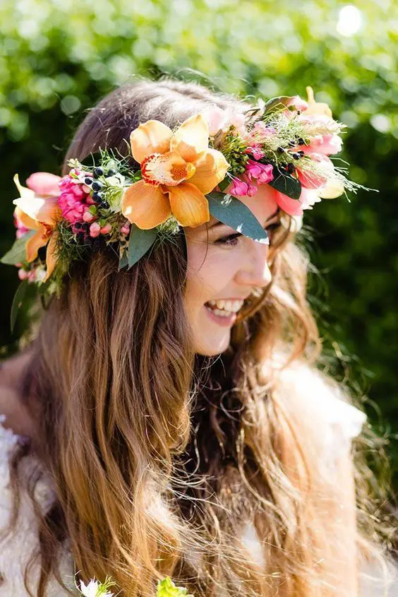 a bright flower crown with yellow and pink blooms, greenery and berries is a gorgeous idea for a bright summer wedding