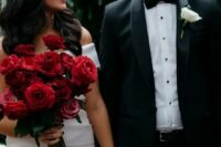 a classic red rose long stem wedding bouquet with leaves is always a good idea, it will add a bit of color and it never goes out of style