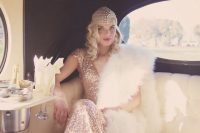 a copper sequin art deco wedding dress paired with an embellished headpiece, a white faux fur coverup creates a gorgeous look