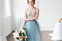 a dreamy wedding dress with an embellished bodice, a blue layered tulle skirt is a very chic and refined solution to rock
