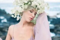a fantastic oversized white floral crown is a beautiful and unusual idea for a spring bride, especially paired with a colored wedding dress