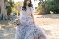 a jaw-dropping lavender A-line wedding dress with a tulle bodice and a layered skirt with a train plus silver shoes