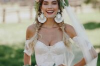 a lovely boho bridal crown with neutral, pastel and bright blooms, large leaves and a seed pod is a fantastic idea for a boho bride