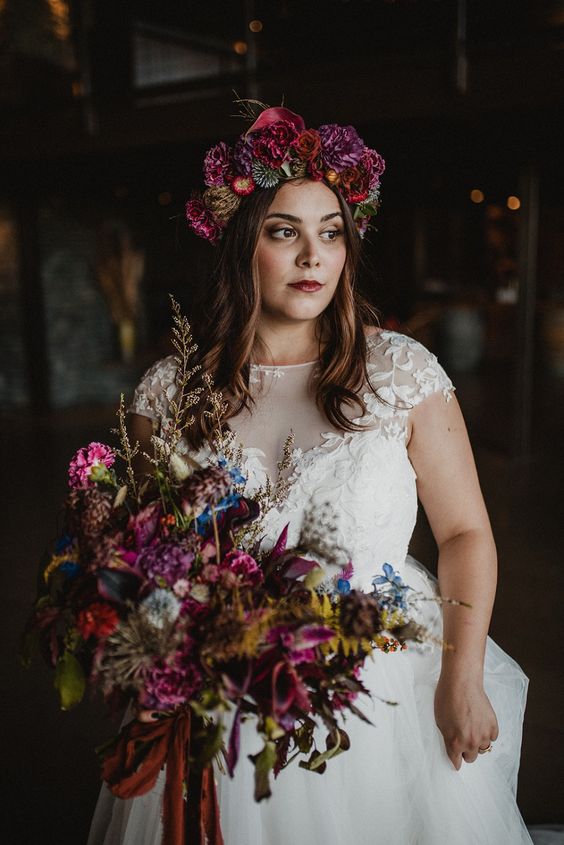 a moody flower crown with deep red, purple and darker dried blooms and allium is a gorgeous idea for the fall