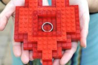 a red Lego heart instead of a usual wedding ring dish will give a special touch to your wedding