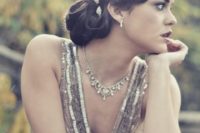 a side updo with fixed curls and a shiny hairpiece is a gorgeous idea for a 1920s or 1930s wedding