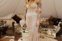 a strapless dusty pink heavily embellished mermaid wedding dress with a train looks spectacular