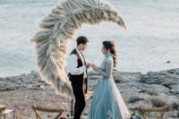 a unique half moon wedding altar made of pampas grass is a very creative piece for your ceremony