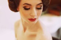 a vintage wedding updo with fixed curls on both sides and a sleek top