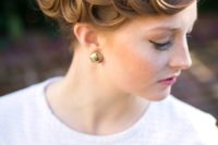 a vintage wedding updo with fixed curls on one side is a cool statement that will help you pull off the look