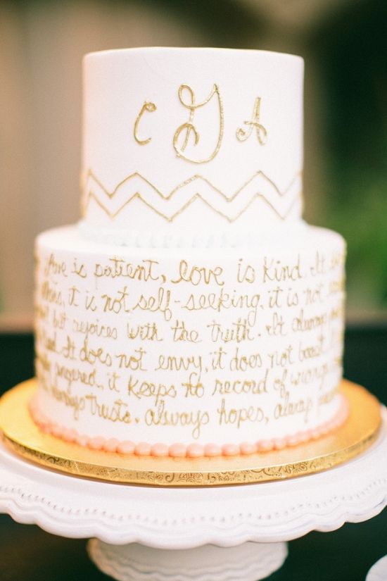 a white buttercream wedding cake featuring gold calligraphy and a love letter is a cool idea for a modern wedding done in neutrals