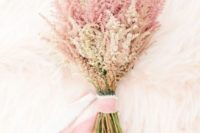 an ethereal pink wedding bouquet with pink ribons is a very cute and girlish idea