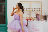 an ultra-modern bridal look with a lilac strapless high low wedding dress wiht neon pink rims and white sneakers is a super chic idea
