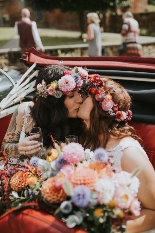 colorful flower crowns with pink, orange, light pink and coral blooms, foliage and allium are amazing for a colorful boho wedding