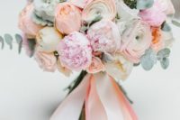 coral and pink wedding bouquet with pale eucalyptus and ribbon is perfect for a spring or summer bride