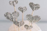 silver glitter heart cake toppers are very cute and cool and can be easily DIYed by you yourself