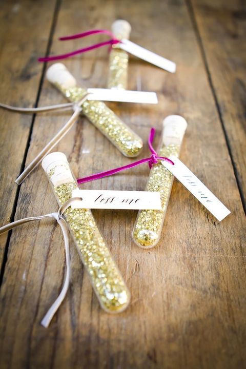 test tubes with gold glitter with tags can be given as wedding favors or can be used by your guests for your wedding exit