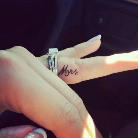 A small and elegant wedding tattoo of Mrs. done in cursive on the side of your finger is a chic girlish idea