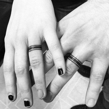 Chic wedding ring tattoos imitating real bands with just three lines