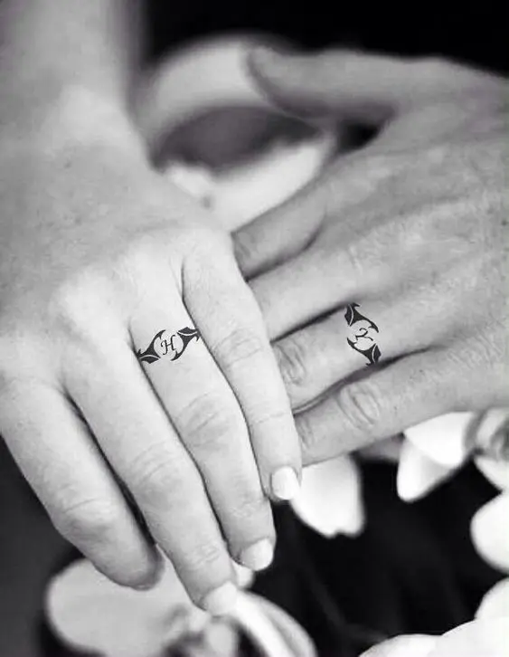 Stylish wedding ring imitating tattoos with a monogram of your partner