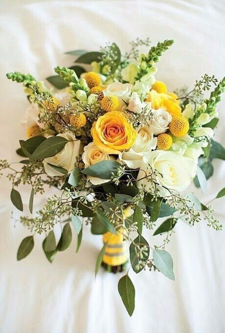 a bold wedding bouquet of yellow and white roses, billy balls, greenery is a stylish solution for spring or summer brides