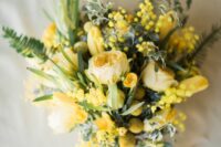 a bold yellow wedding bouquet of peony roses, tulips, billy balls, mimosas and greenery is an amazing idea for spring