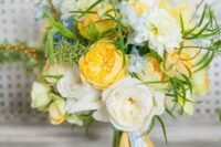 a bright and cool wedding bouquet with yellow and neutral blooms, touches of blue, greenery and long ribbons