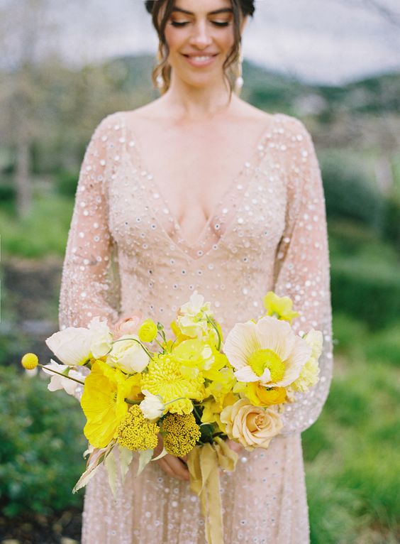 a bright wedding bouquet of yellow poppies and billy balls, neutral roses and pink poppies is amazing