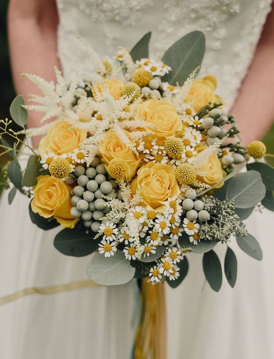 a cool yellow rose wedding bouquet with berries, chamomiles, greenery and some astilbe will work for spring or summer