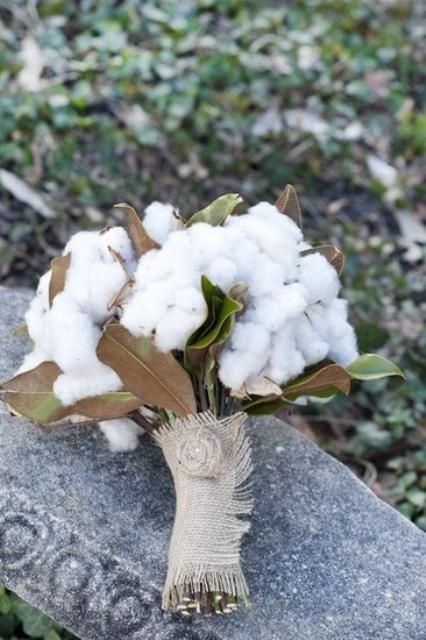 a cotton wedding bouquet with magnolia leaves and a burlap wrap for a southern bride