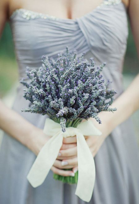 a lavender wedding bouquet with a large neutral bow of ribbon is a chic and dreamy idea