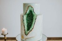 a marble emerald geode wedding cake with copper details is a chic and trendy idea