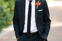 a modern groom’s outfit with a black pantsuit, a white shirt and a black skinny tie, a bright floral boutonniere is a great idea for the fall