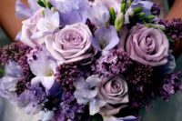 a purple and lilac wedding bouquet features different shades of purple